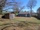 Large backyard with storage shed and lawn at 2046 Cartier Way, Charlotte, NC 28208