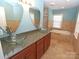 Luxurious bathroom boasts dual sinks, granite countertop, and a jacuzzi tub at 2046 Cartier Way, Charlotte, NC 28208
