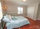 Bright bedroom offers hardwood flooring and an abundance of natural light at 2046 Cartier Way, Charlotte, NC 28208