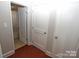 Hallway with access to a full bathroom and closet at 2046 Cartier Way, Charlotte, NC 28208