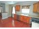 Charming kitchen features stainless steel appliances, wooden cabinets, and abundant natural light at 2046 Cartier Way, Charlotte, NC 28208