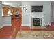Open-concept living space featuring a fireplace and seamless flow into the adjacent kitchen at 2046 Cartier Way, Charlotte, NC 28208