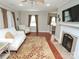 Living room with hardwood floors, a fireplace, and a large television at 2046 Cartier Way, Charlotte, NC 28208