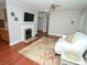 Bright living room features a fireplace, TV, hardwood floors, and neutral paint at 2046 Cartier Way, Charlotte, NC 28208