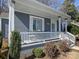Inviting porch with white railings and a cozy seating area at 2046 Cartier Way, Charlotte, NC 28208