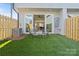 Cozy backyard features artificial turf and outdoor seating, perfect for relaxing or entertaining guests at 206 Freeland Ln, Charlotte, NC 28217