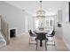 Bright dining space features modern lighting and seating, seamlessly connecting to the kitchen and living areas at 206 Freeland Ln, Charlotte, NC 28217