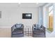 Comfortable living space with plush chairs, a TV, and a serene ambiance perfect for relaxation at 206 Freeland Ln, Charlotte, NC 28217