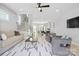 Bright living room with modern furnishings, neutral tones, and natural light creates a welcoming atmosphere at 206 Freeland Ln, Charlotte, NC 28217