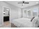 Bright main bedroom featuring a large bed, wood floors and an ensuite bathroom at 206 Freeland Ln, Charlotte, NC 28217