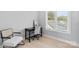 Bright office space with a modern desk, chair, and lots of natural light at 206 Freeland Ln, Charlotte, NC 28217