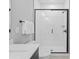Modern bathroom showcasing a tiled shower with glass door, toilet, and vanity at 210 Freeland Ln, Charlotte, NC 28217