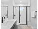 Contemporary bathroom with a walk-in shower, modern fixtures, and minimalist design for a clean, fresh look at 210 Freeland Ln, Charlotte, NC 28217
