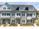 Charming townhome with classic architectural details and a well-maintained facade in a desirable neighborhood at 210 Freeland Ln, Charlotte, NC 28217