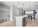 Bright kitchen featuring modern island with sleek appliances, minimalist lighting, and an open-concept design at 210 Freeland Ln, Charlotte, NC 28217