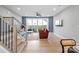 Cozy living room featuring comfortable seating, a sliding glass door, natural light, and hardwood floors at 210 Freeland Ln, Charlotte, NC 28217