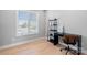 Bright office space with a large window, sleek desk, and minimalist design, ideal for productivity at 210 Freeland Ln, Charlotte, NC 28217
