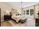 A serene main bedroom with soft lighting, a cozy bed, and a view of the outdoors at 2227 Indigo Branch Rd, Indian Land, SC 29707