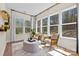 Bright sunroom featuring large windows offering scenic views, perfect for relaxation and enjoying nature at 2227 Indigo Branch Rd, Indian Land, SC 29707