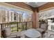 Private balcony with brick columns, comfortable seating, and outdoor table for entertaining at 2251 Selwyn Ave # 201, Charlotte, NC 28207