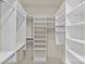 This walk-in closet offers plenty of shelving space and natural light at 2251 Selwyn Ave # 201, Charlotte, NC 28207