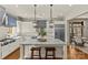 Eat-in kitchen includes granite island with seating, and stainless steel refrigerator at 2251 Selwyn Ave # 201, Charlotte, NC 28207
