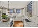 Gourmet kitchen with white cabinets, subway tile backsplash, and stainless steel appliances at 2251 Selwyn Ave # 201, Charlotte, NC 28207