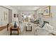 Open-concept living room with hardwood floors, fireplace, and access to a kitchen at 2251 Selwyn Ave # 201, Charlotte, NC 28207
