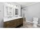 Bathroom showcasing dual sink vanity, tiled flooring, and a walk-in shower at 228 Tot Dellinger Rd, Cherryville, NC 28021