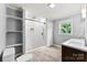 Beautiful bathroom with double vanity, walk-in shower, and wood look tile flooring at 228 Tot Dellinger Rd, Cherryville, NC 28021