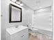 Clean bathroom featuring a single vanity, toilet, mirror, and a shower with tile flooring at 228 Tot Dellinger Rd, Cherryville, NC 28021