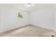 Compact bedroom featuring a window bringing natural light and neutral-toned walls at 228 Tot Dellinger Rd, Cherryville, NC 28021