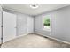 Bright bedroom with two closets and a window at 228 Tot Dellinger Rd, Cherryville, NC 28021