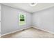 Bedroom with natural light coming in through a window and neutral walls at 228 Tot Dellinger Rd, Cherryville, NC 28021