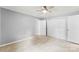 Comfortable bedroom with gray walls, carpet, closet space and ceiling fan at 228 Tot Dellinger Rd, Cherryville, NC 28021
