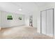 Spacious bedroom with carpet floors, two windows, and access to a closet at 228 Tot Dellinger Rd, Cherryville, NC 28021