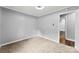 Bedroom with a ceiling fan, carpet floors, and a bathroom access at 228 Tot Dellinger Rd, Cherryville, NC 28021
