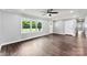 Clean, bright living room with hardwood floors, a window, and neutral paint, showing an entrance and doorway at 228 Tot Dellinger Rd, Cherryville, NC 28021