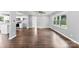 Spacious living room with hardwood floors, recessed lighting, and large windows for natural light, with kitchen view at 228 Tot Dellinger Rd, Cherryville, NC 28021