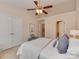 Bright bedroom featuring a ceiling fan, closet, and ensuite access at 244 Hurston Cir, Charlotte, NC 28208