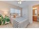 Bedroom featuring a ceiling fan, neutral walls and white double door closet at 244 Hurston Cir, Charlotte, NC 28208