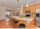 Bright, open kitchen showcases stainless steel appliances, peninsula, and easy access to the dining area at 244 Hurston Cir, Charlotte, NC 28208