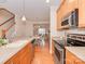Functional kitchen featuring stainless steel appliances, ample counter space, and seamless flow into dining area at 244 Hurston Cir, Charlotte, NC 28208