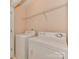 Bright laundry room featuring a washer, dryer, and wire shelving at 244 Hurston Cir, Charlotte, NC 28208