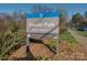 Frazier Park sign with lush landscaping and walking path visible at 244 Hurston Cir, Charlotte, NC 28208