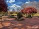Beautiful park with mature trees, brick pathways and play area at 244 Hurston Cir, Charlotte, NC 28208