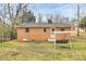 Brick home with a modest backyard and a detached outbuilding or shed at 2548 Milton Ave, Gastonia, NC 28052
