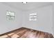 Bright bedroom features new laminate flooring and two windows at 2548 Milton Ave, Gastonia, NC 28052
