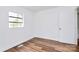 The room features new laminate flooring, a window, and an access door at 2548 Milton Ave, Gastonia, NC 28052