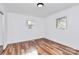 This bedroom has new floors and bright light from two windows at 2548 Milton Ave, Gastonia, NC 28052
